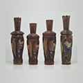four brown duck calls standing up